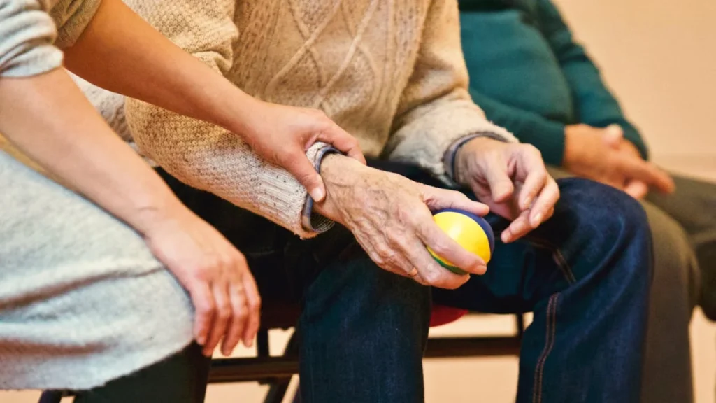 Person Holding a Stress Ball // Healthier Me Today